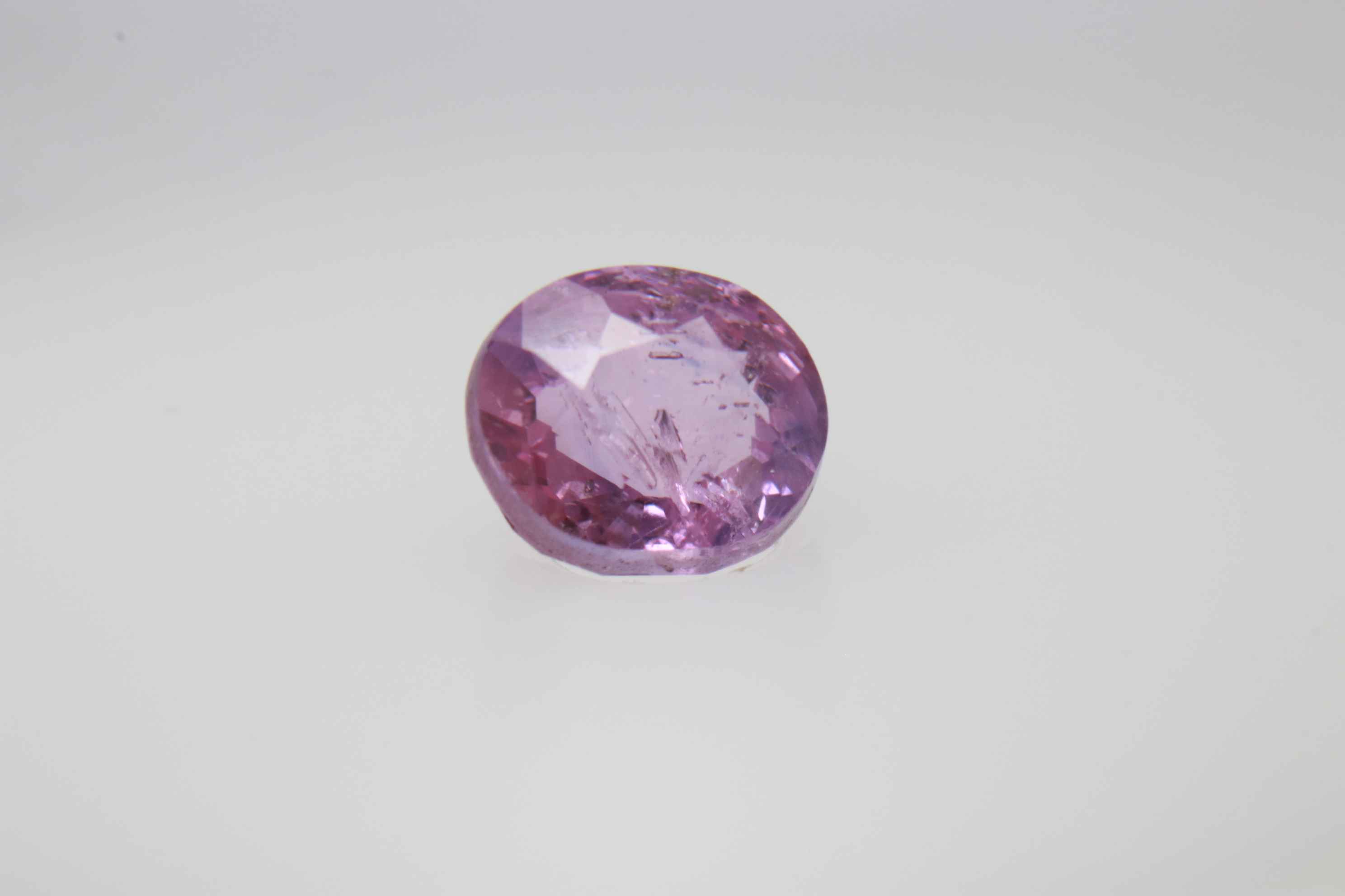 0.9ct Hot Pink Padparadscha VVS Oval Shape (5.8x4.8x3.5 mm) Unheated gemstone from Sri Lanka