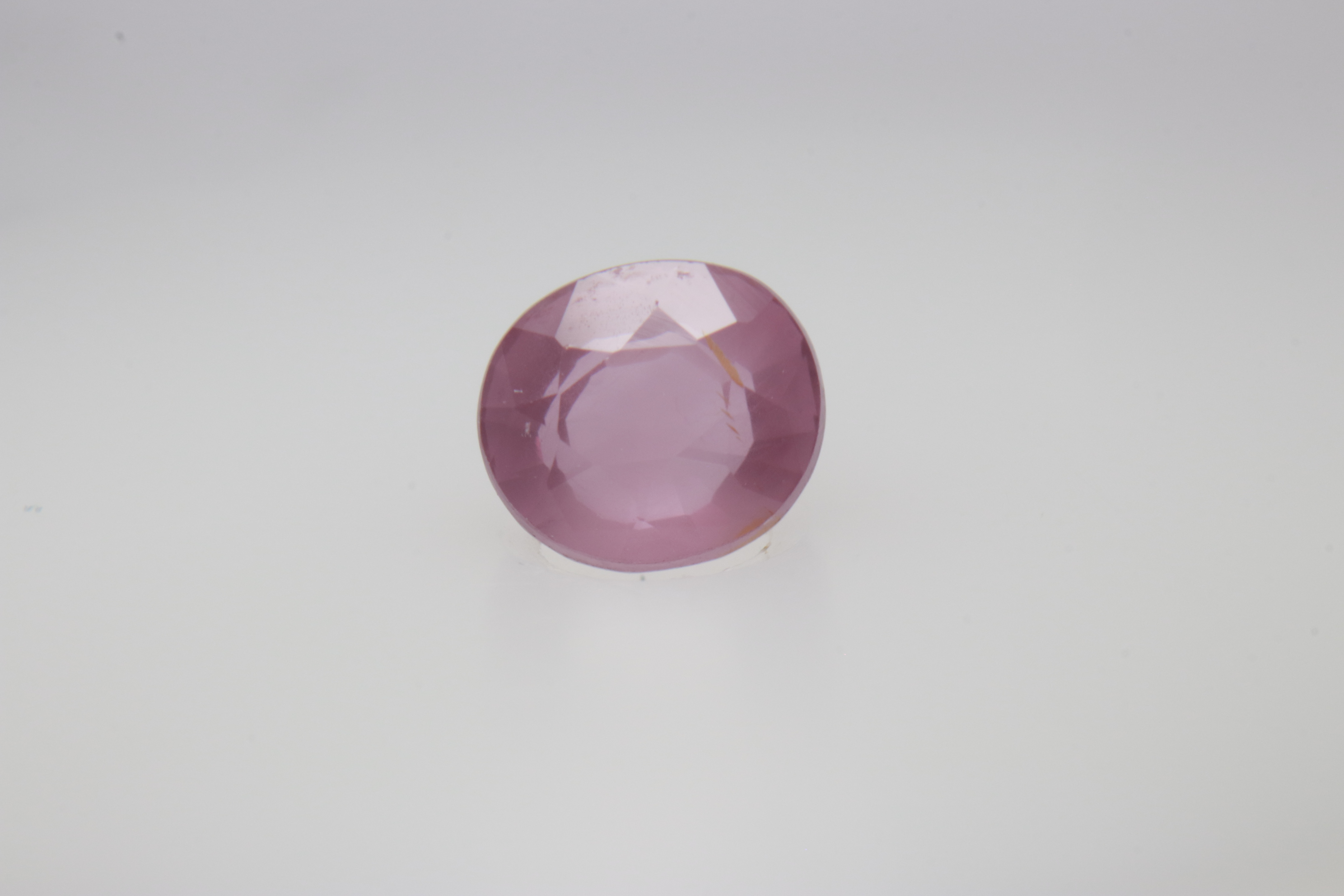 0.6ct Hot Pink Padparadscha VVS Oval Shape (5.2x4.6x3.1 mm) Unheated gemstone from Sri Lanka