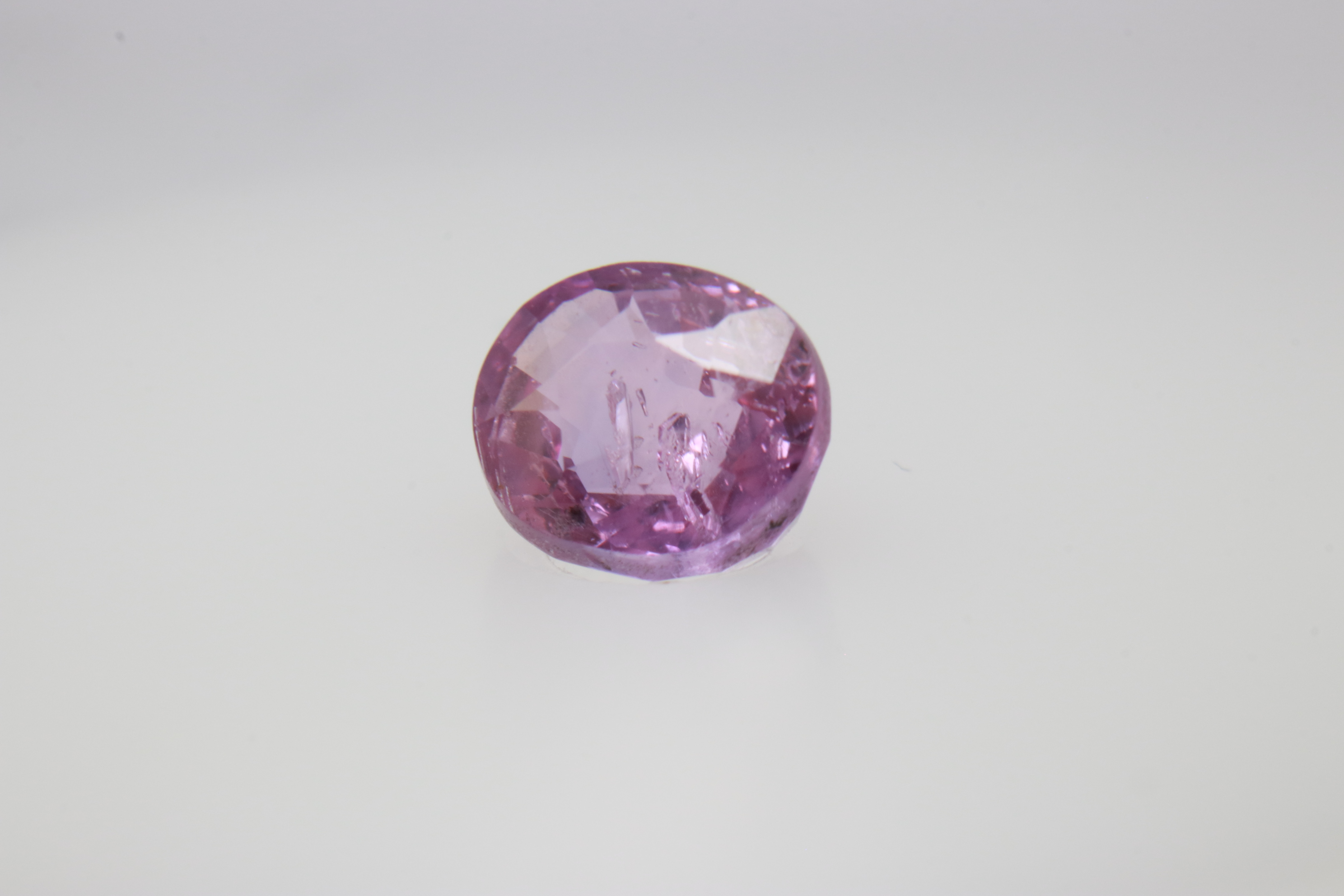 0.9ct Hot Pink Padparadscha VVS Oval Shape (5.8x4.8x3.5 mm) Unheated gemstone from Sri Lanka